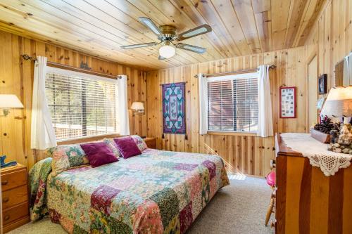 a bedroom with a bed and a ceiling fan at 7 Cedar Lodge in Wawona
