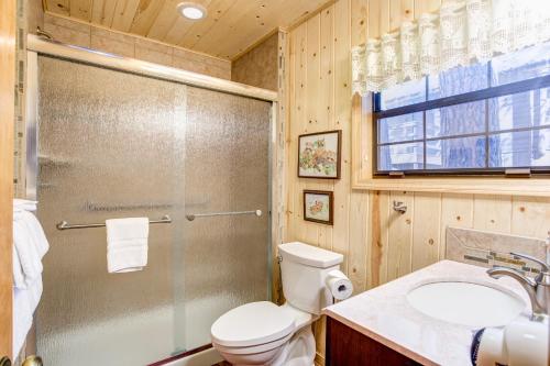 a bathroom with a shower and a toilet and a sink at 7 Cedar Lodge in Wawona