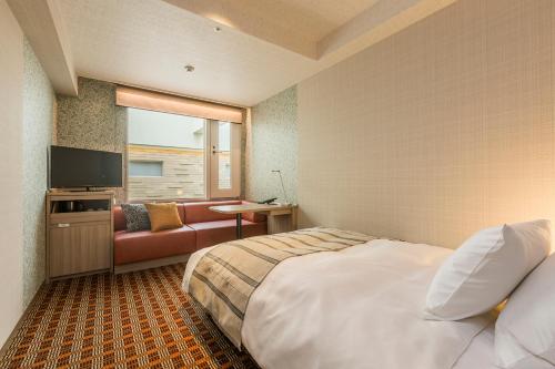 Postel nebo postele na pokoji v ubytování Garden Hotel Shizuoka
