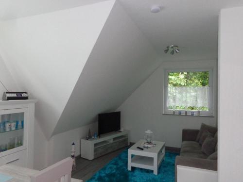 TV a/nebo společenská místnost v ubytování Haus-Hempel
