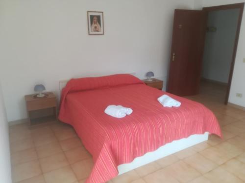 Ein Bett oder Betten in einem Zimmer der Unterkunft Donnabella House