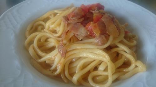 a white bowl of pasta with bacon on it at Valle del Belvedere in Spoleto