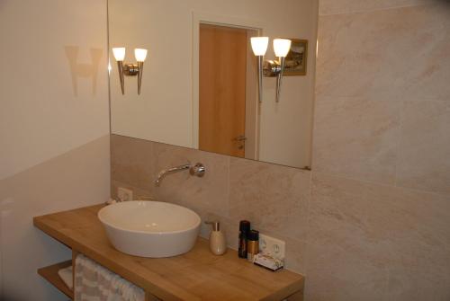 a bathroom with a sink and a mirror at Wohlfühlapartment in Minden in Minden