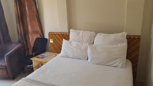 Ένα ή περισσότερα κρεβάτια σε δωμάτιο στο Ridgesea Guest House