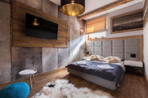 מיטה או מיטות בחדר ב-Aparthotel Góralski Spa