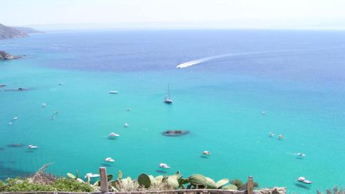 a view of a large body of water with boats at Case Vacanze Sangeni in Capo Vaticano