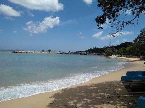 a view of a beach with the ocean at Chamod Holiday Home in Tangalle