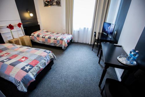 Postel nebo postele na pokoji v ubytování Hotel Granada