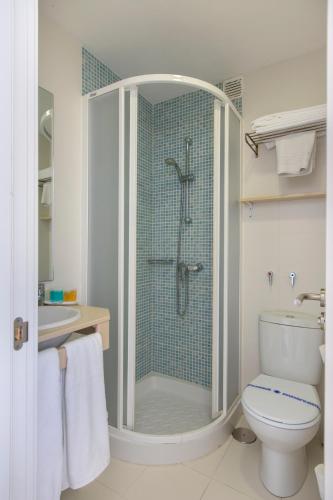 a bathroom with a shower with a toilet and a sink at Flats Friends Atlantida in Benidorm