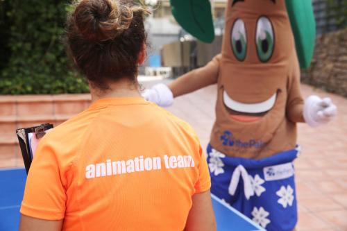 a woman standing next to a person wearing an animation team at Eurosalou & Spa in Salou