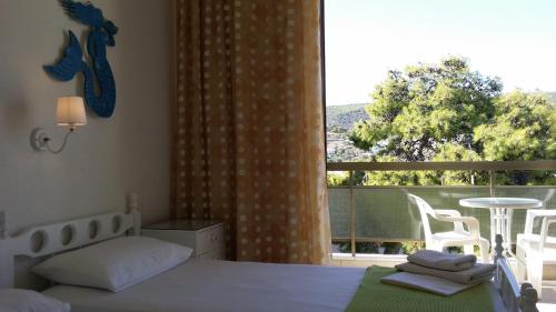 Postel nebo postele na pokoji v ubytování Rachel Hotel