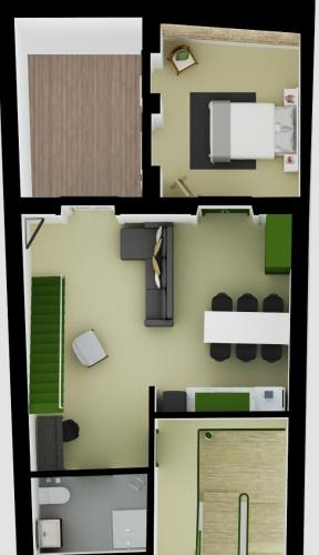 a floor plan of a small apartment with green at DoBairro suites at Bairro Alto in Lisbon