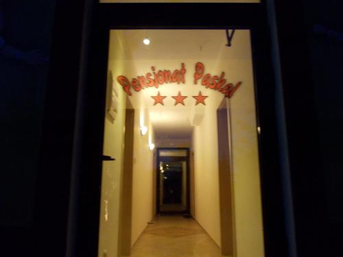 a hallway with a sign that reads restaurant party at Pensjonat Paskal in Czerlejno