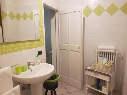 a bathroom with a sink and a mirror at La Crota in Asti