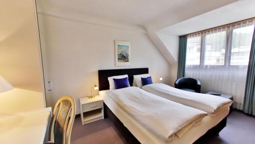 Säng eller sängar i ett rum på Residenz Larix Apartments