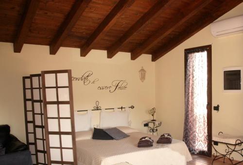 Posteľ alebo postele v izbe v ubytovaní L'Isola Felice Apartment