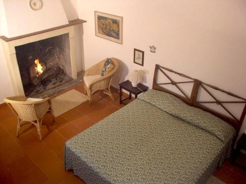 Ένα ή περισσότερα κρεβάτια σε δωμάτιο στο Agriturismo Montecalvo