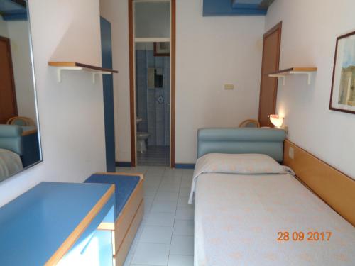 Giường trong phòng chung tại Hotel Ambasciatori Palace