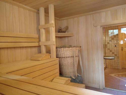 a room with a sauna with a staircase in it at Wiesemann Biohof in Anterselva di Mezzo