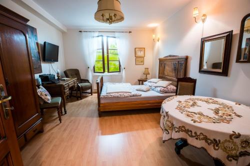 Posteľ alebo postele v izbe v ubytovaní Apartament Perła Kartuz z sauną