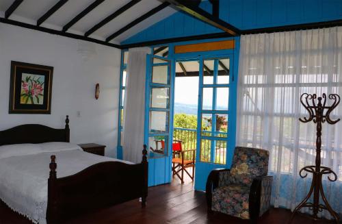 Llit o llits en una habitació de Casa Hotel El Compadre
