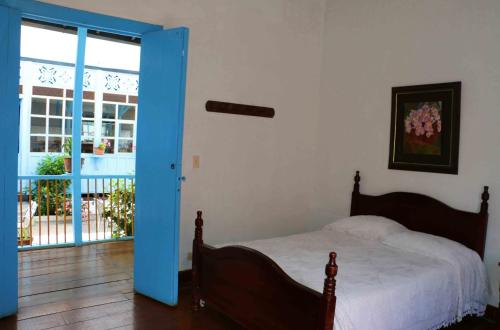 Postel nebo postele na pokoji v ubytování Casa Hotel El Compadre
