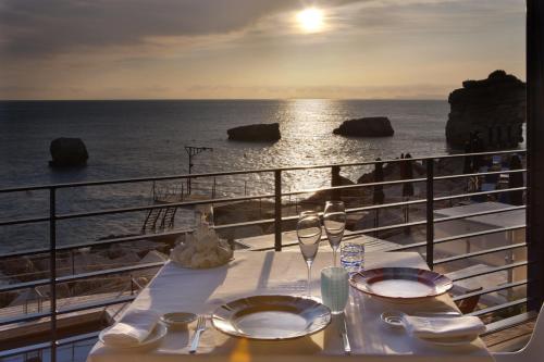 a table on a cruise ship looking at the ocean at Capo la Gala Hotel&Wellness in Vico Equense