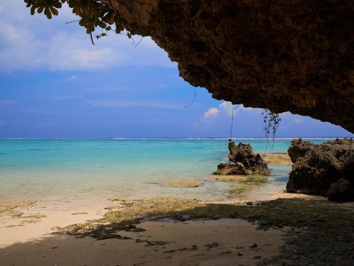 a view of the ocean from inside a cave at Cottage Sea Wind Nakijin in Nakijin