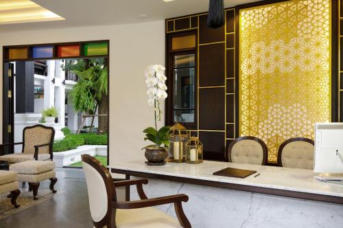 a dining room with a table and chairs at Thai Akara - Lanna Boutique Hotel in Chiang Mai
