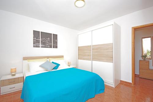 A bed or beds in a room at Apartments Imgrund