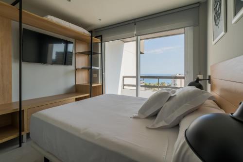 Postel nebo postele na pokoji v ubytování Apartamentos Dubamar