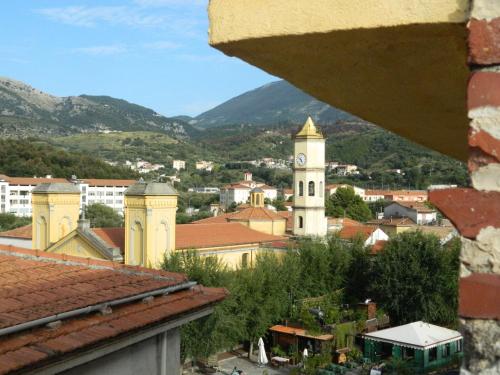 a view of a town with a clock tower at Hotel Del Sole Al Plebiscito in Sapri