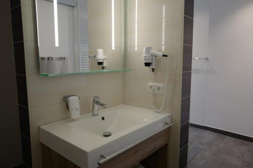 Koupelna v ubytování Hotel Stern