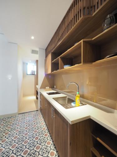 a kitchen with a sink and a counter top at Mai's Boutique in Da Nang