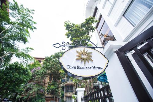 a sign on the side of a building at Dinh Elegant Hanoi Hotel in Hanoi