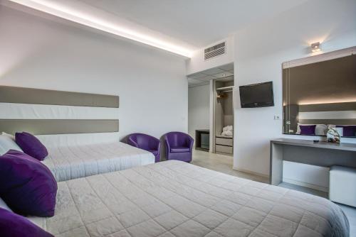 Postel nebo postele na pokoji v ubytování Hotel Boemia
