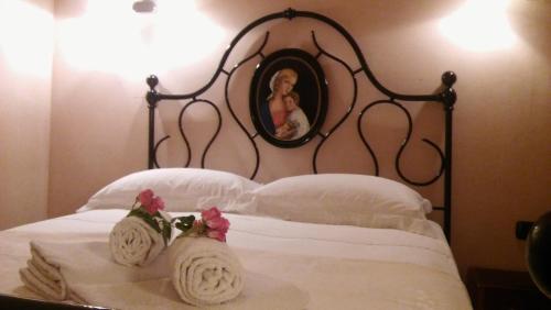 Postel nebo postele na pokoji v ubytování Agriturismo il Bacucco