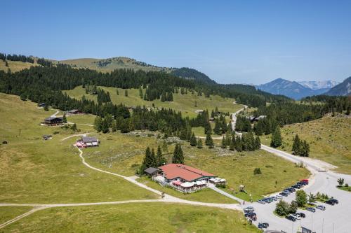 an aerial view of a resort in the mountains at Postalm Lodge in Seidegg