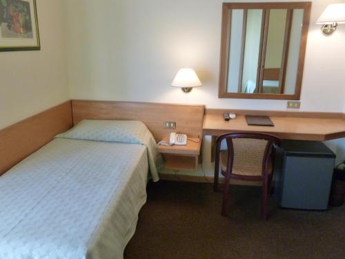 Postel nebo postele na pokoji v ubytování Hotel Plaza