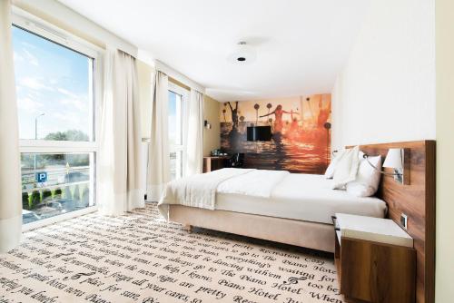 Ένα ή περισσότερα κρεβάτια σε δωμάτιο στο Hotel Piano