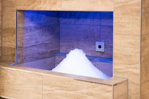 a pile of white snow in a bath tub at Hotel Adler - Paulas Alb in Ehingen