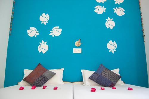 מיטה או מיטות בחדר ב-Hotel Rising Star