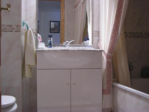 a bathroom with a sink and a toilet at Vacanza Complex in Benidorm