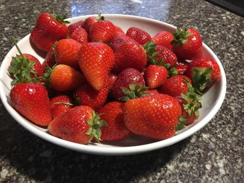 a bowl of strawberries sitting on a table at La Corte D'Emilio B&B in Vignola