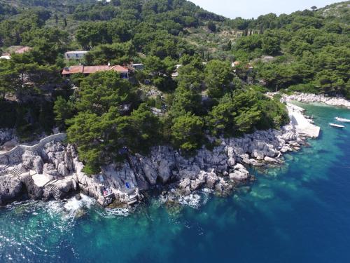 an aerial view of a rocky island in the water at Apartments Stermasi in Saplunara