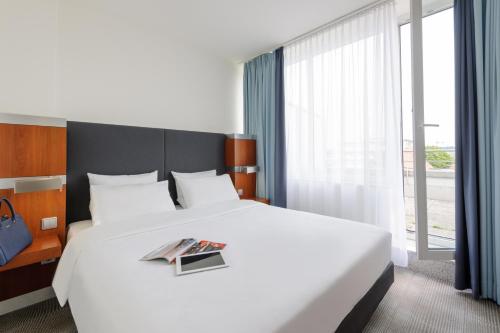 Katil atau katil-katil dalam bilik di Novotel Erlangen