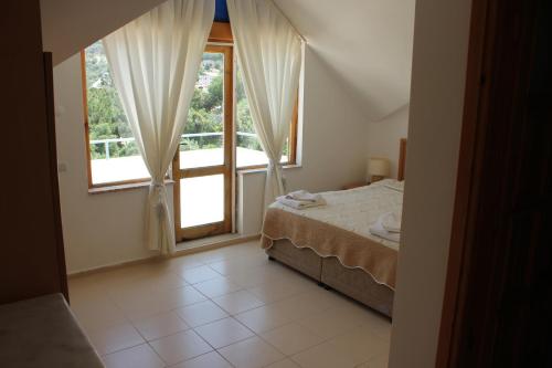 Кровать или кровати в номере Korsanada Hotel