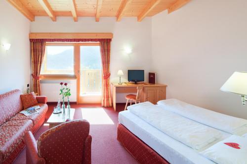 Postel nebo postele na pokoji v ubytování Hotel Antermoia