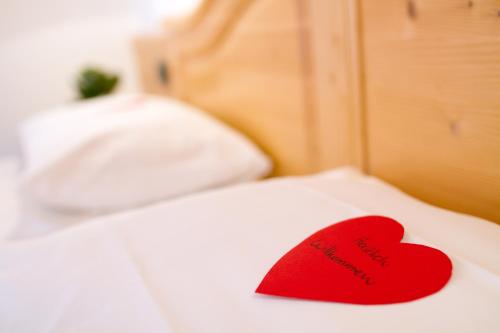 Ένα ή περισσότερα κρεβάτια σε δωμάτιο στο Hotel Antermoia