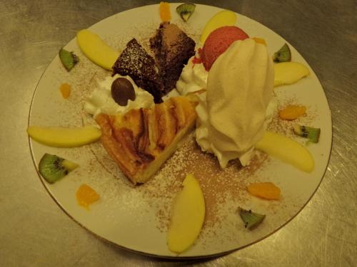 a plate of food with pie and ice cream at Hotel-Spa & Restaurant Logis Domaine Langmatt in Murbach